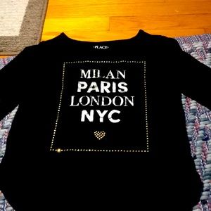 A Black children’s place shirt